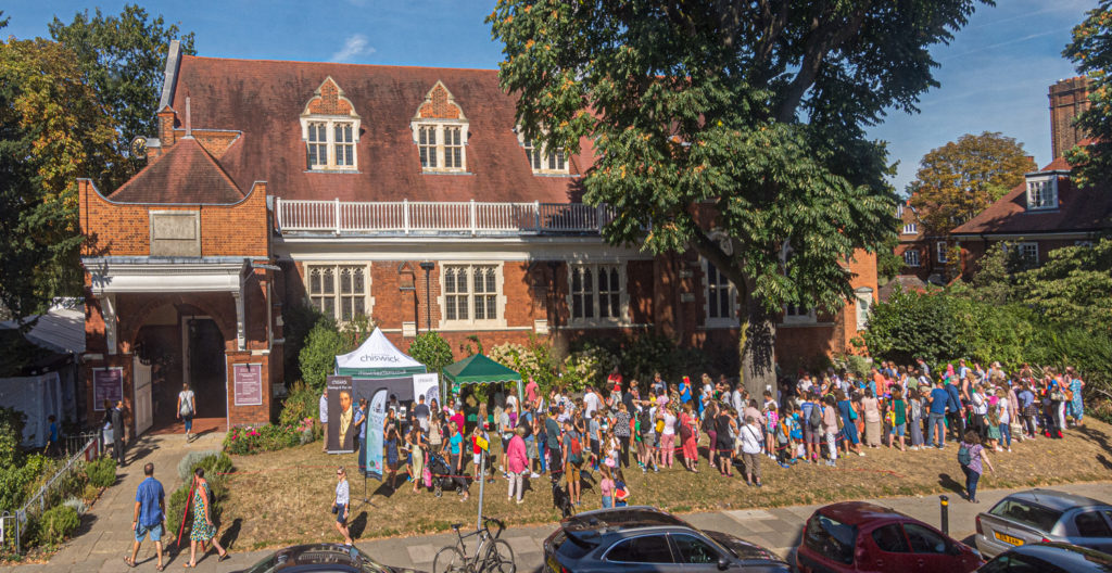 2019 Chiswick Book Festival crowds surround St Michael & All Angels Church in Bedford Park, Chiswick, for a book signing by How To Train Your Dragon author and Children's Laureate Cressida Cowell.