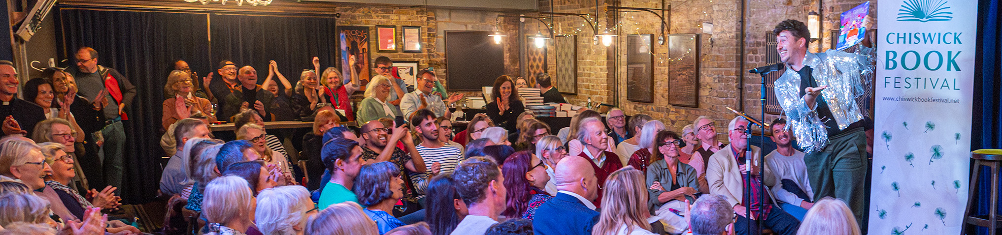 The Chiswick Book Festival Local Authors Showcase on 10 September 2025 at the historic George IV pub in Chiswick featured 21 authors from Chiswick and west London, giving each of them just two minutes to speak about their book, making for a fast-paced, fun and fascinating evening.